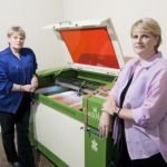 SMALL BUSINESS, BIG MACHINE: Kay and Stephanie Spruill use a machine with a laser that can engrave every- thing from leather to granite to glass and can handle materials as large as 3 feet wide and 21.5 inches deep.